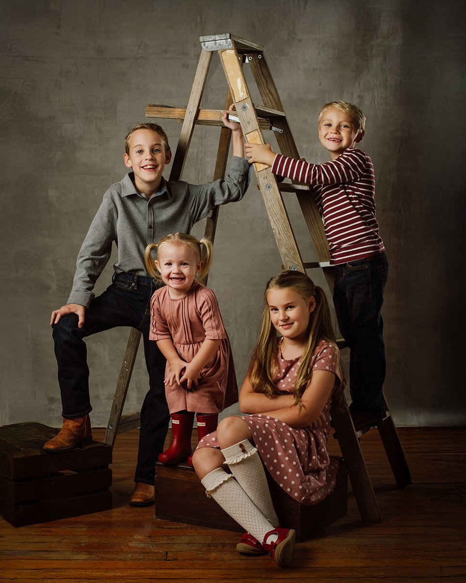 Four Kids Fall Theme in Studio Smiling